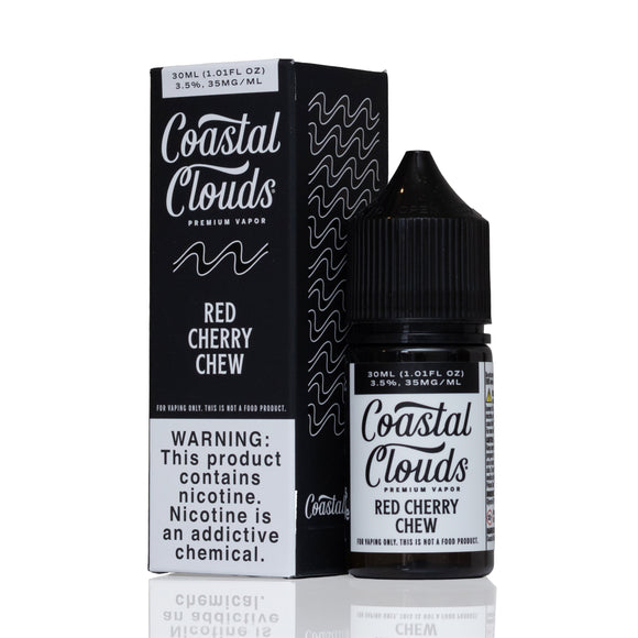 A bottle of Coastal Clouds Red Cherry Chew premium vapor liquid next to its black packaging box, displayed on a clean white background with a subtle reflection.