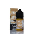 A 30ml bottle of Kilo Vanilla Almond Custard e-liquid next to its matching packaging box, displayed on a reflective white surface against a white background.