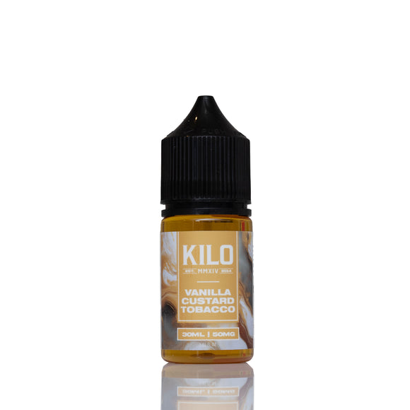 A 10ml bottle of Kilo Vanilla Custard Tobacco e-liquid, featuring amber-colored liquid inside a clear bottle with a black childproof cap and a beige label, set against a plain white background with a soft reflection.