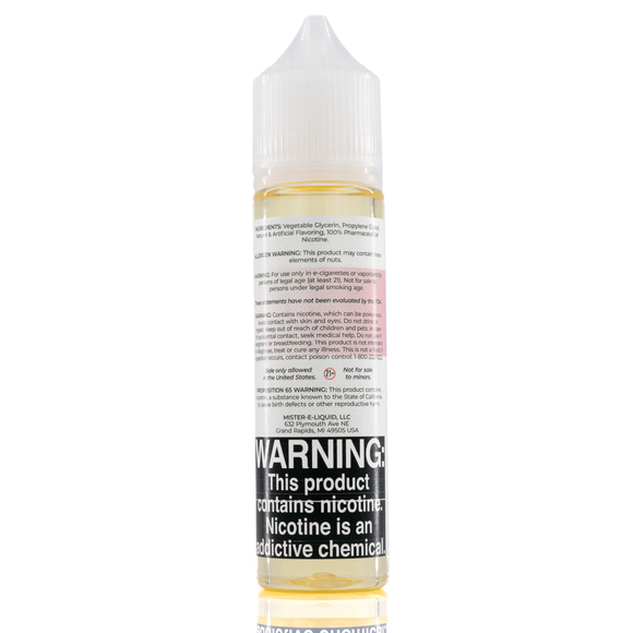 A mister e-liquid bottle is placed on a reflective surface and against a white background. The bottle outlines the ingredients and the warning label. 
