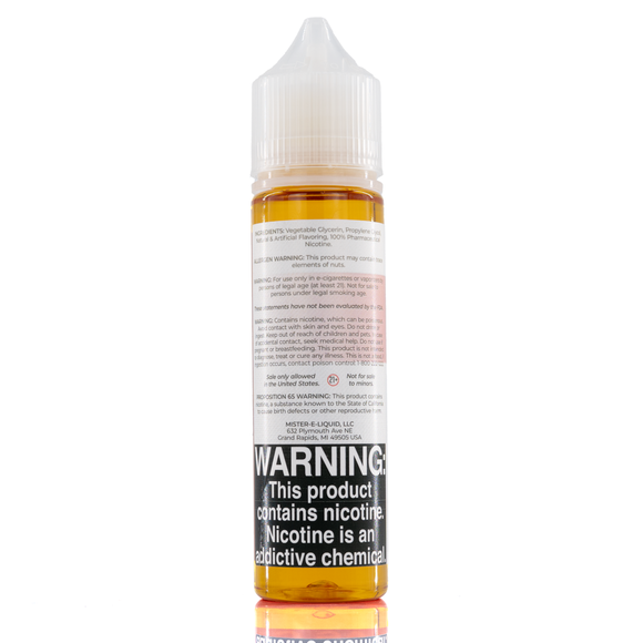 A mister e-liquid bottle is placed on a reflective surface and against a white background. The bottle outlines the ingredients and the warning label. 
