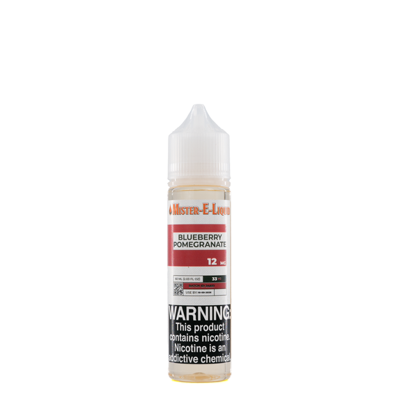 A 12mg mister e-liquid bottle of 'blueberry pomegranate' is placed on a reflective surface and against a white background. The label is red, grey, and white.