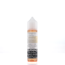 A mister e-liquid bottle is placed on a reflective surface and against a white background. The bottle outlines the ingredients and the warning label. 