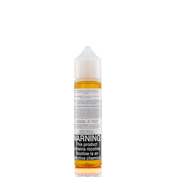 A mister e-liquid bottle is placed on a reflective surface and against a white background. The bottle outlines the ingredients and the warning label. 