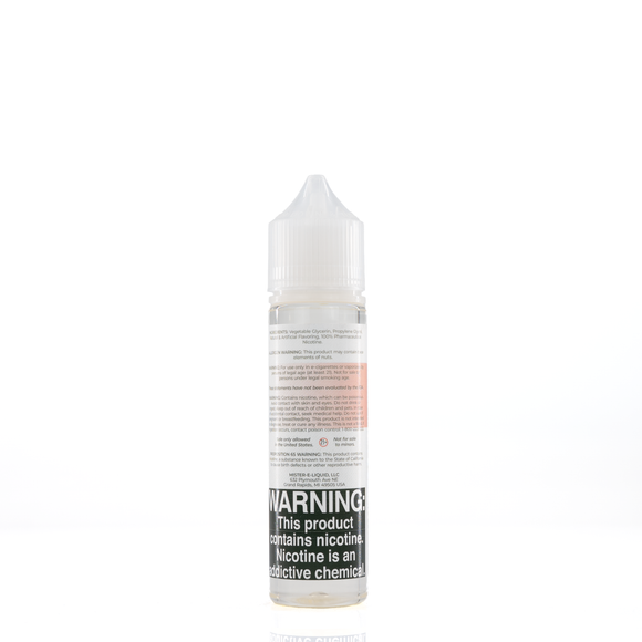 A mister e-liquid bottle is placed on a reflective surface and against a white background. The bottle outlines the ingredients and the warning label. 