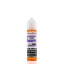 A 12mg mister e-liquid bottle of 'straight grape' is placed on a reflective surface and against a white background. The label is purple, grey, and white.