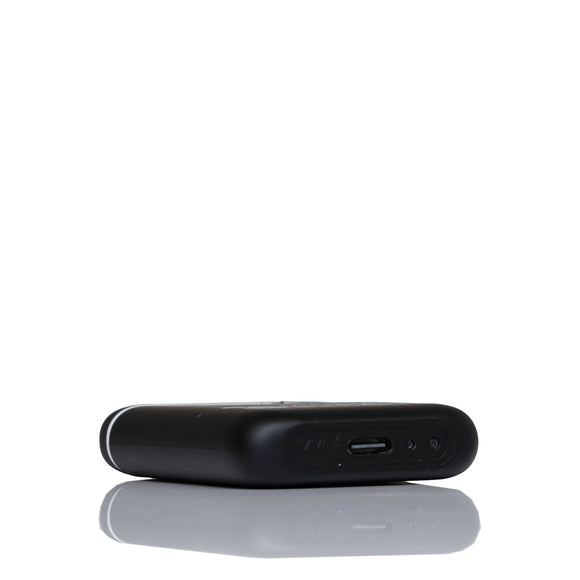 A black rectangular electronic device, shown from a side angle, featuring a USB-C port on its side, set against a plain white background with a soft reflection below.