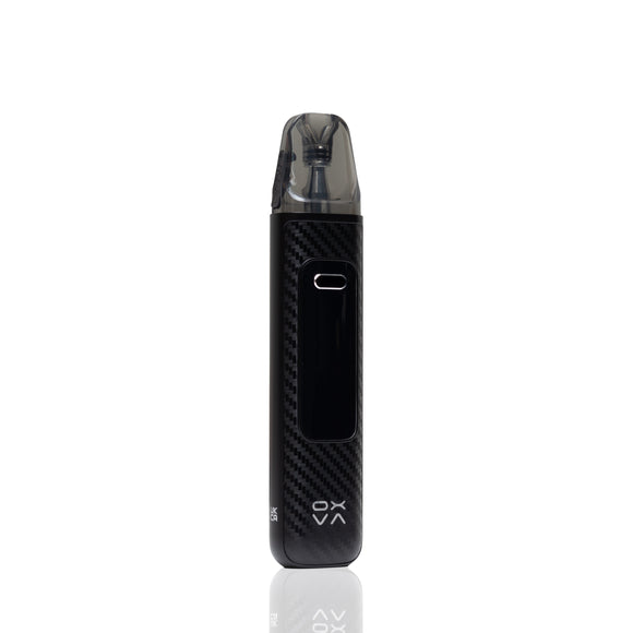 A black vape device with a carbon fiber pattern body, a clear mouthpiece, and a digital display screen, shown vertically on a white background with a faint reflection below.